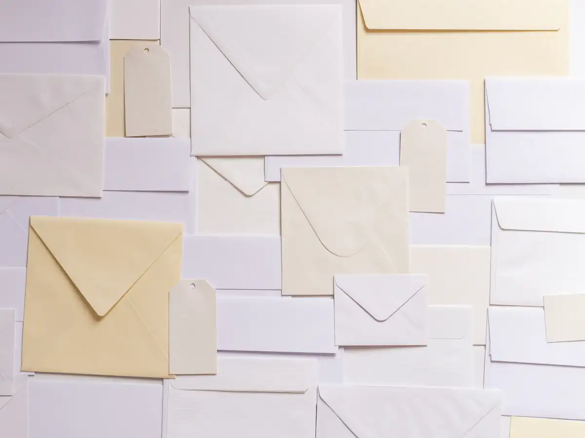 Pile of paper envelopes representing email attachments