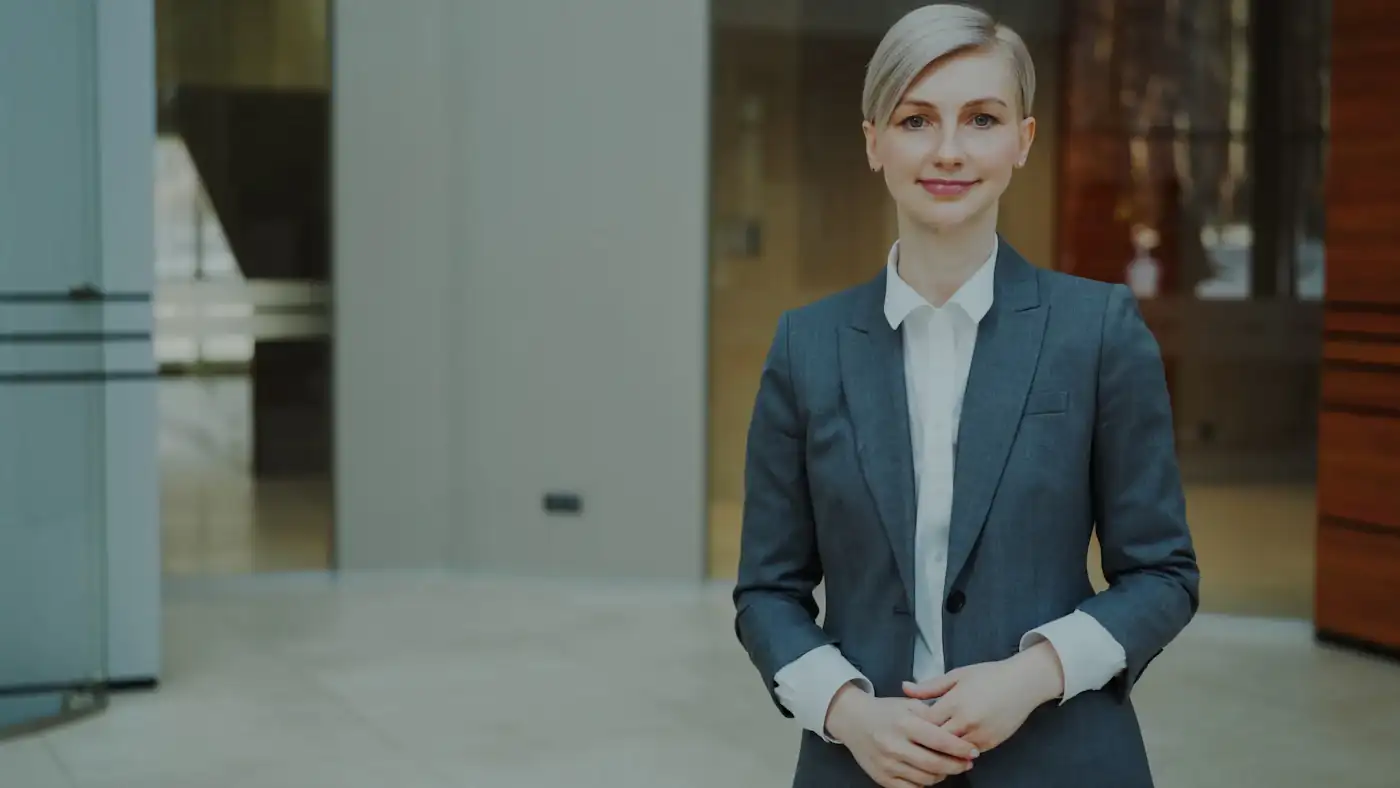 Professional businesswoman in a suit smiling confidently