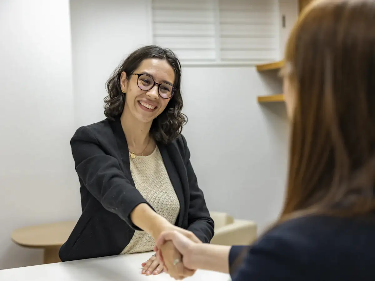 Recruiter shaking hands with a candidate after an interview