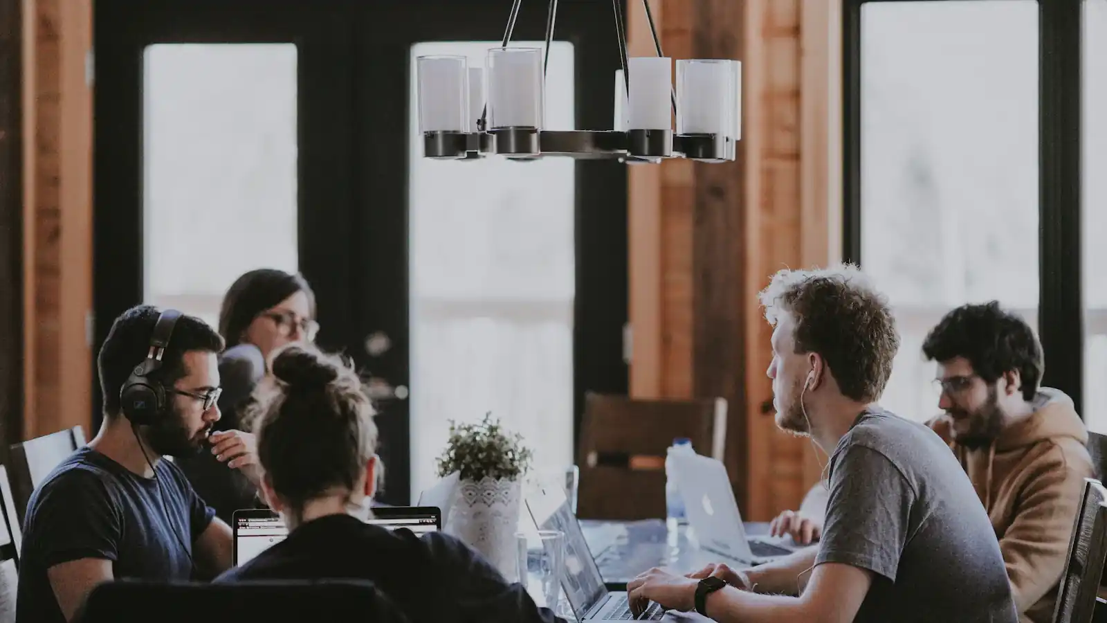 Agency team working together at a shared table in an office