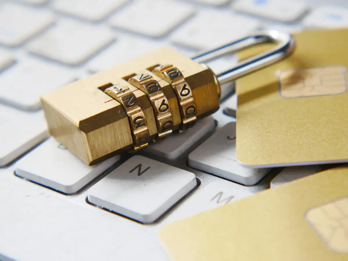 Golden padlock resting on a keyboard representing privacy