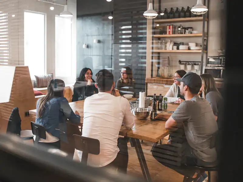 Colleagues in a relaxed team discussion in a modern office