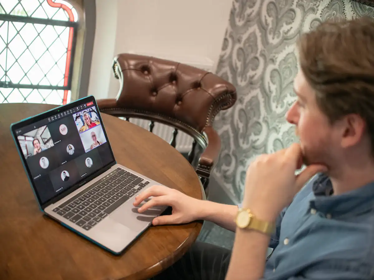 Man on a laptop taking part in a video conference call